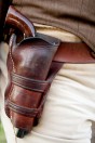 a gun in a Western-style, leather holster