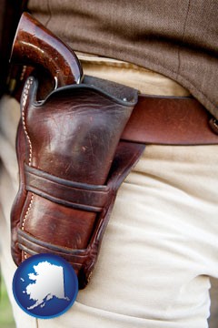 a gun in a Western-style, leather holster - with Alaska icon