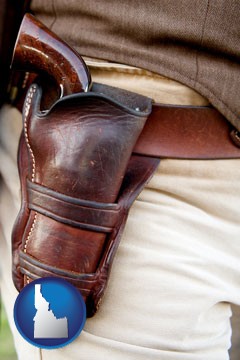 a gun in a Western-style, leather holster - with Idaho icon