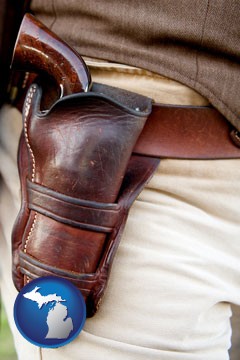 a gun in a Western-style, leather holster - with Michigan icon