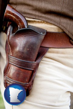 a gun in a Western-style, leather holster - with Minnesota icon