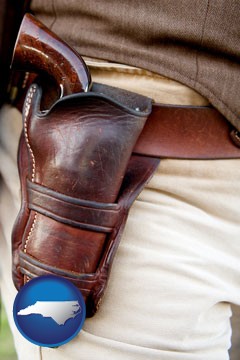 a gun in a Western-style, leather holster - with North Carolina icon