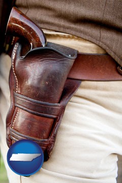 a gun in a Western-style, leather holster - with Tennessee icon